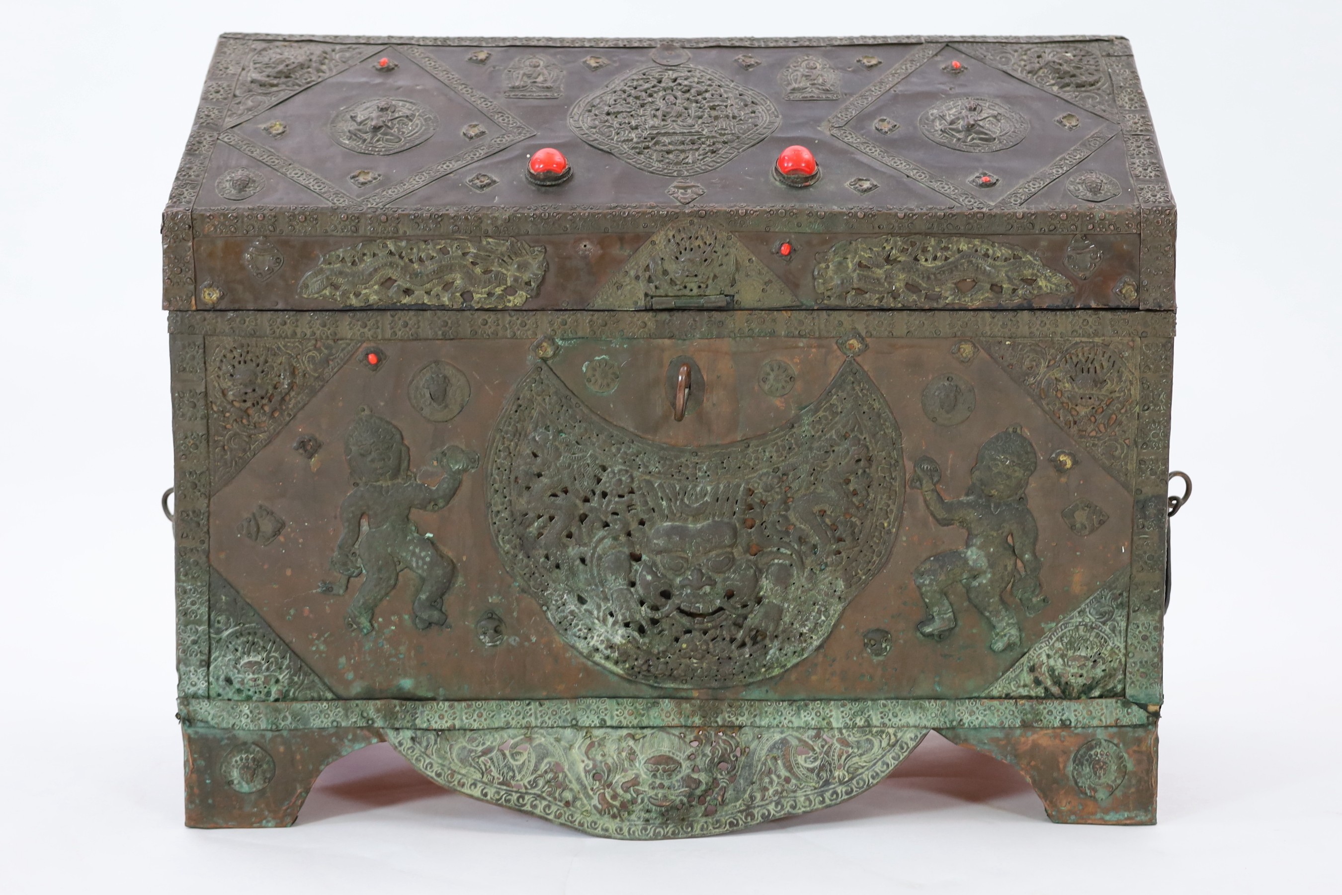 A Tibetan copper repousse-work casket, 20th century, 65cm wide, 49.5cm